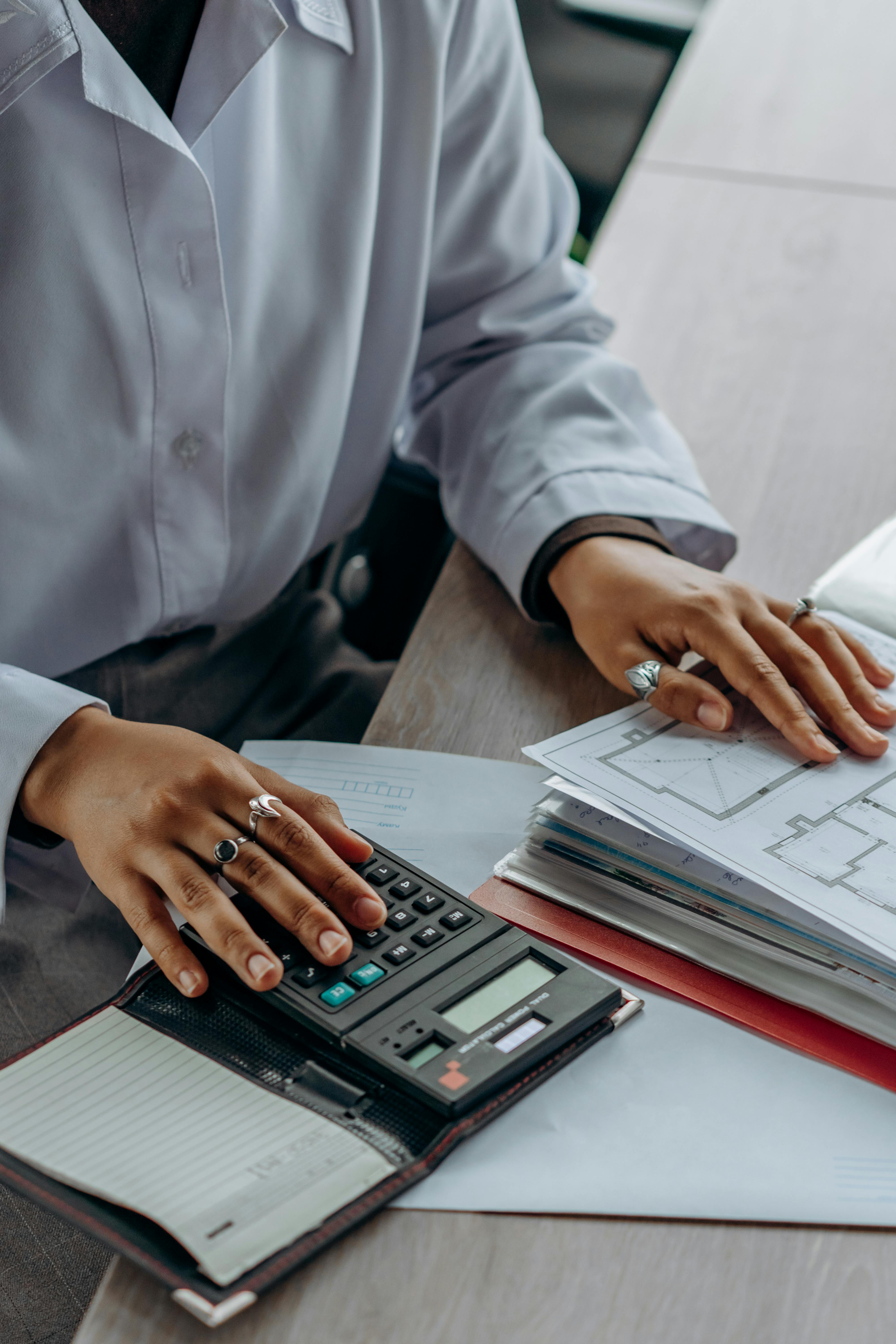Cornerstone accountant working through a client's books at the office desk