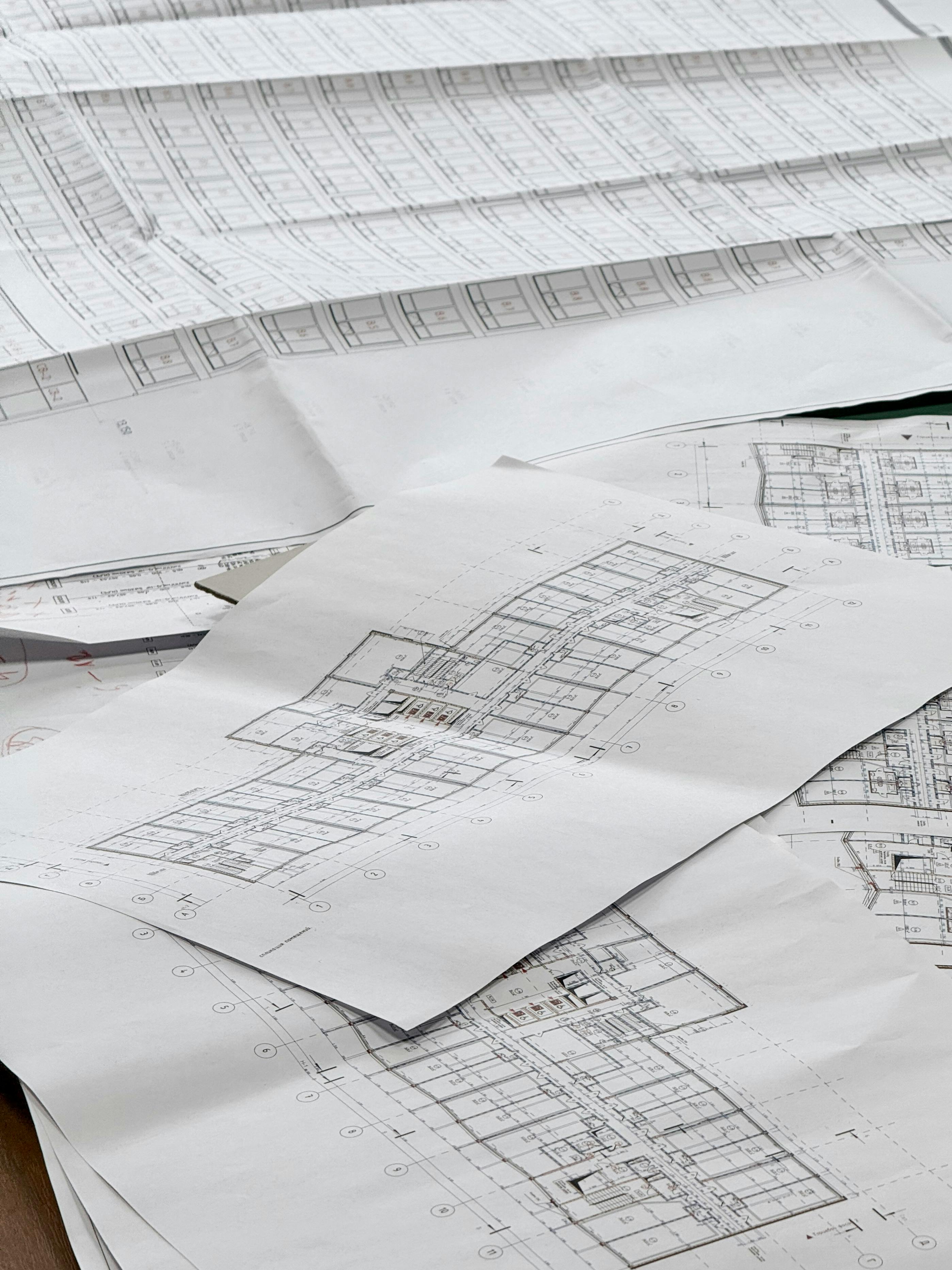 Architectural sketch overlay on a hillside site, conveying the studio's site-first design process