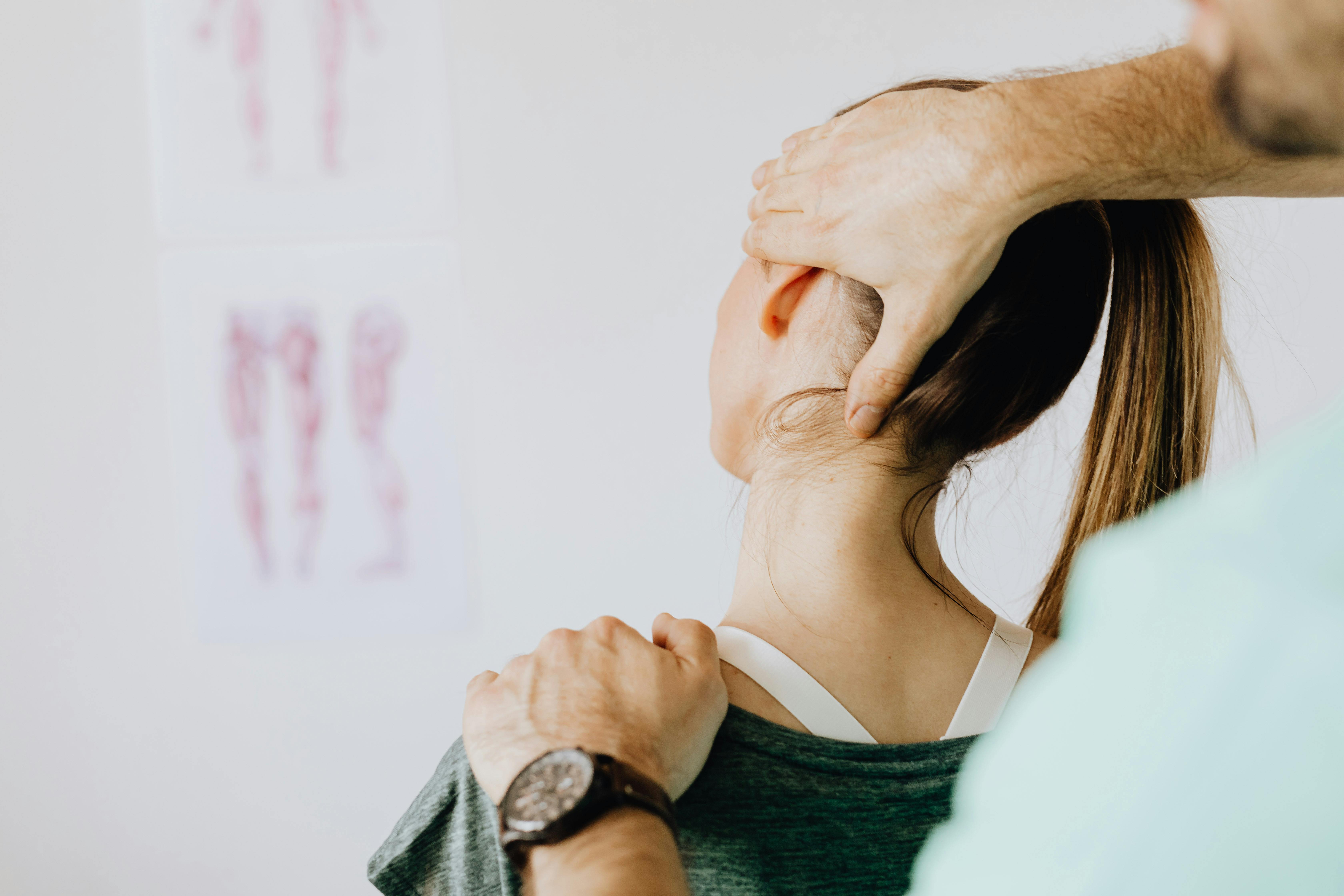 Patient doing corrective exercises with chiropractor