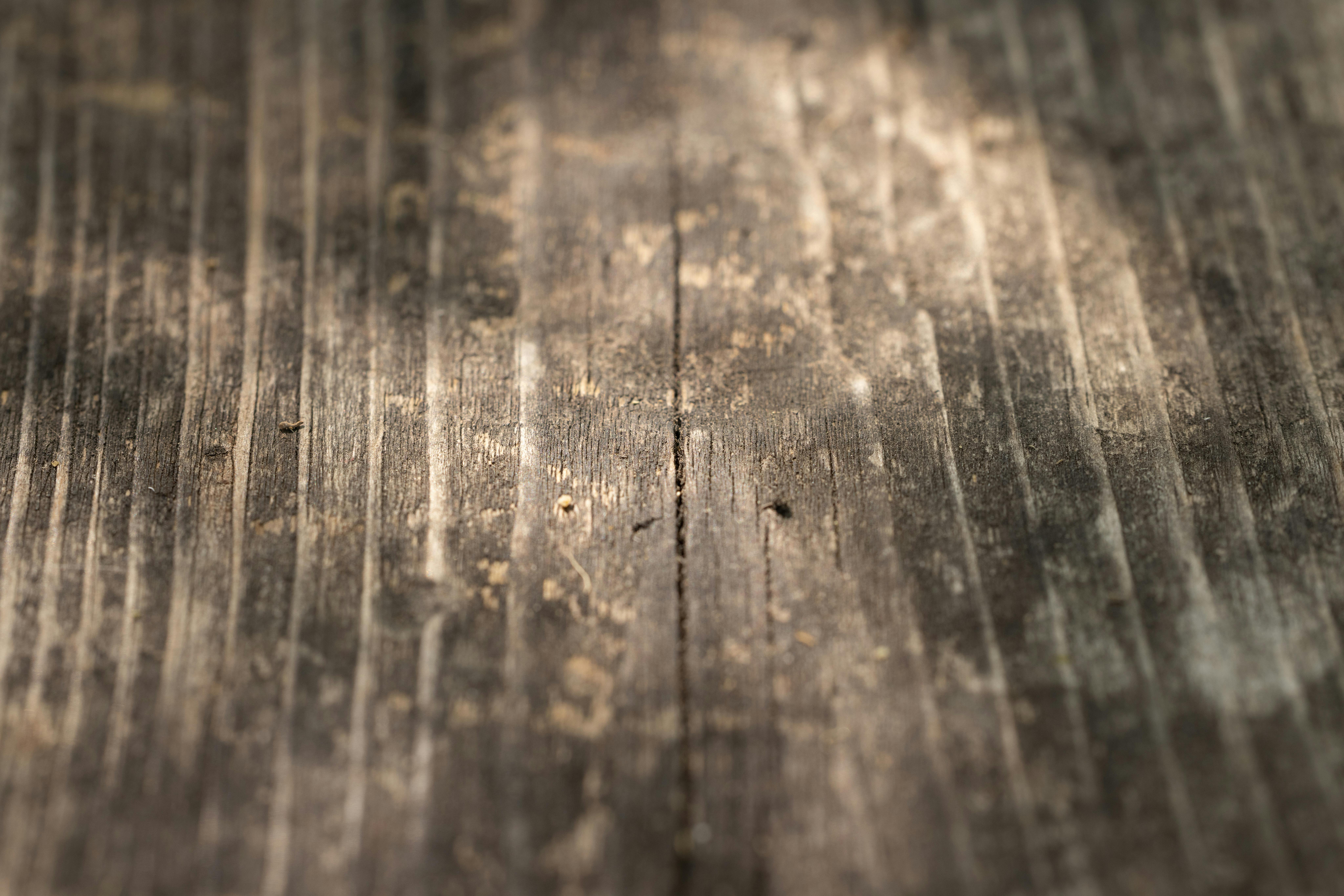 Weathered wood texture representing decades of quality craftsmanship
