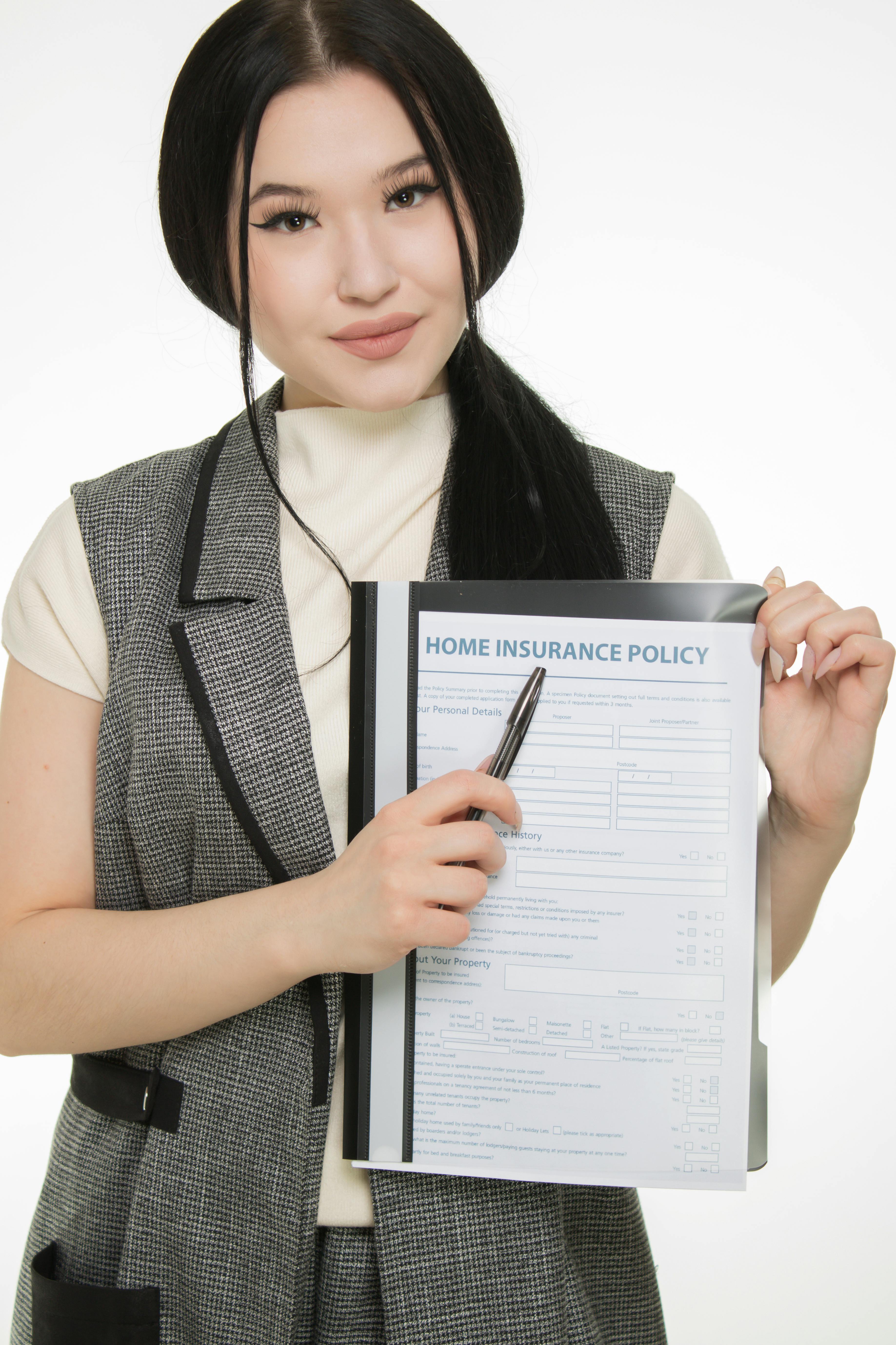 Insurance documents and coverage comparison on a desk