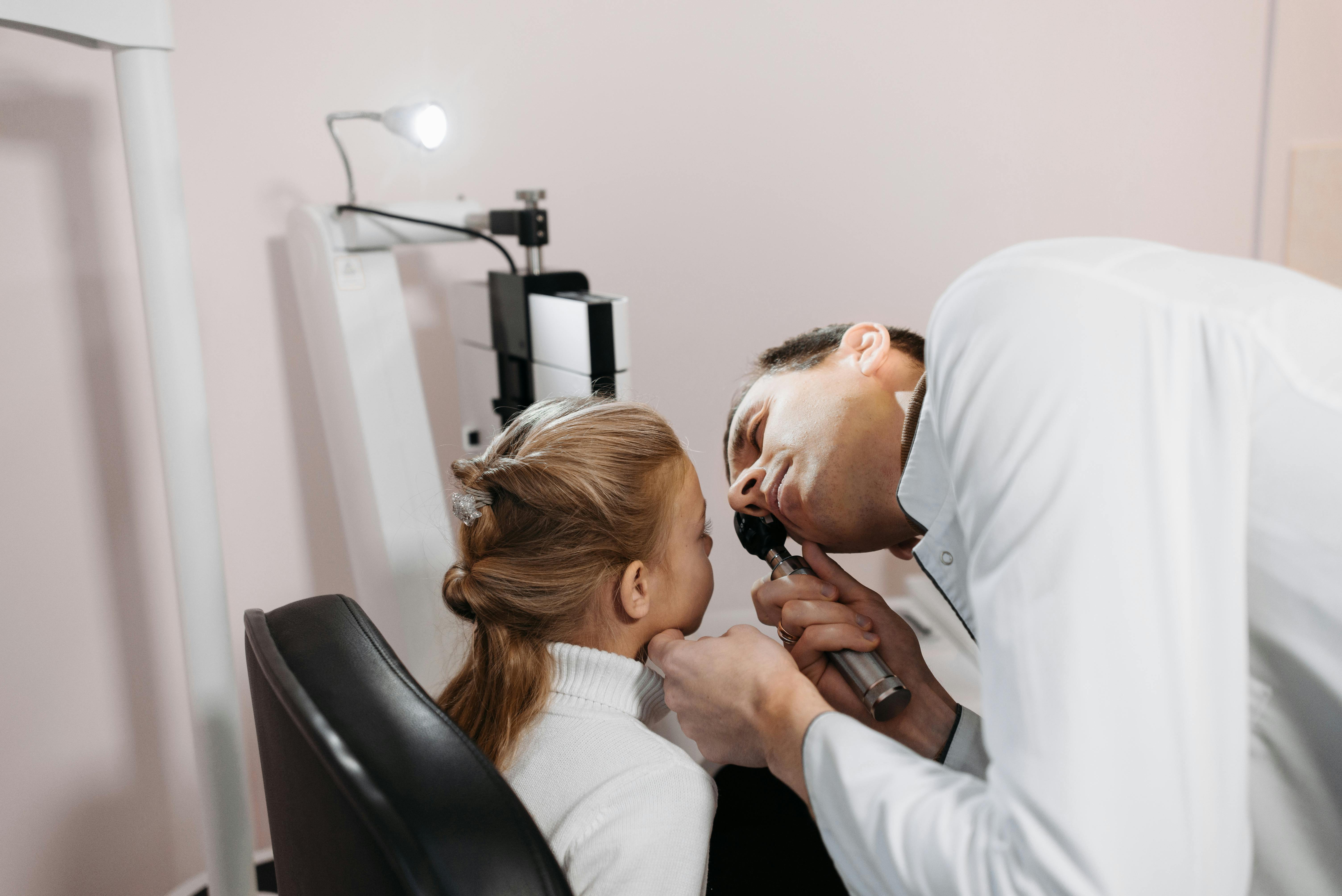 Physician conducting a thorough examination with focused attention on patient