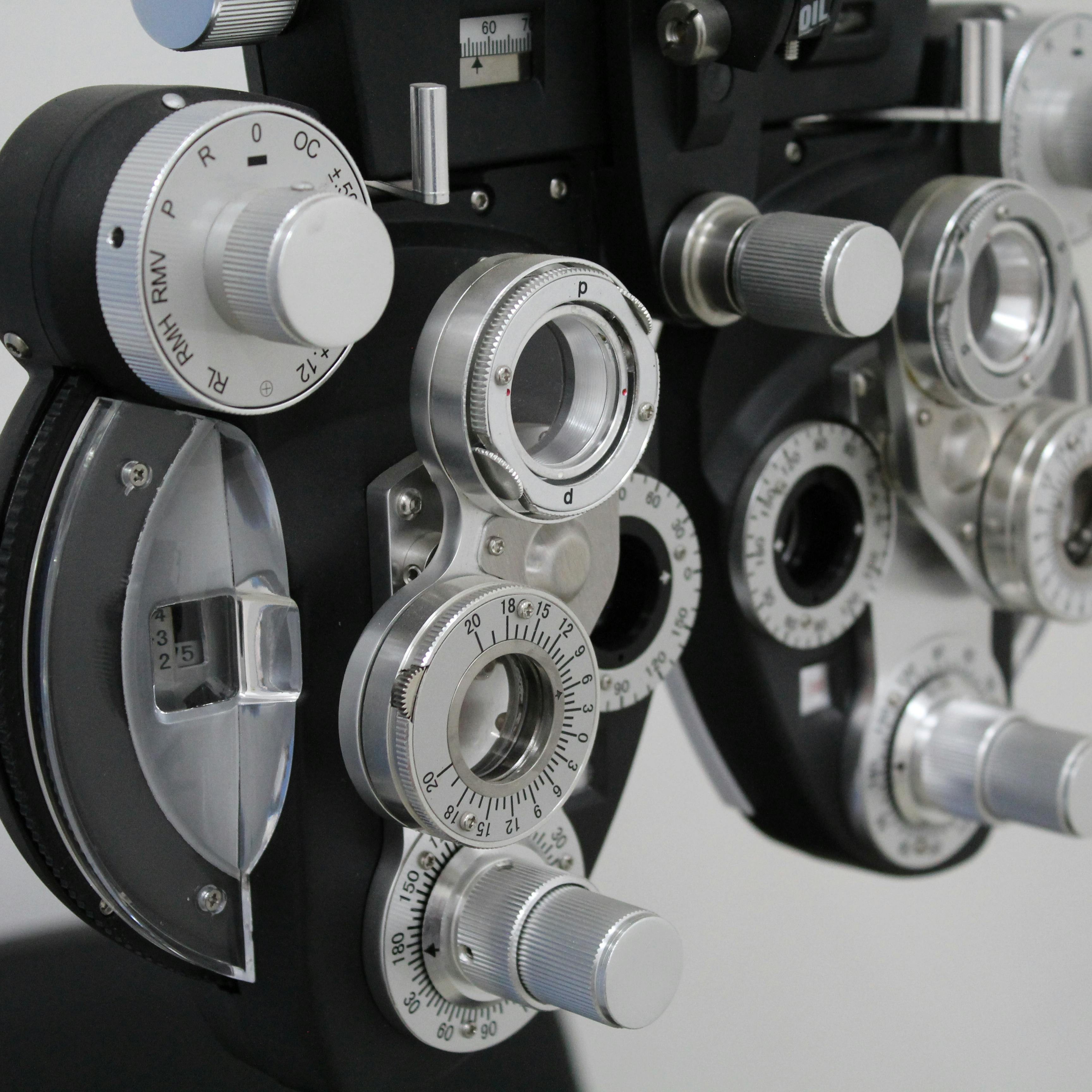 Close-up of precision phoropter dials used for diagnostic refractive measurement