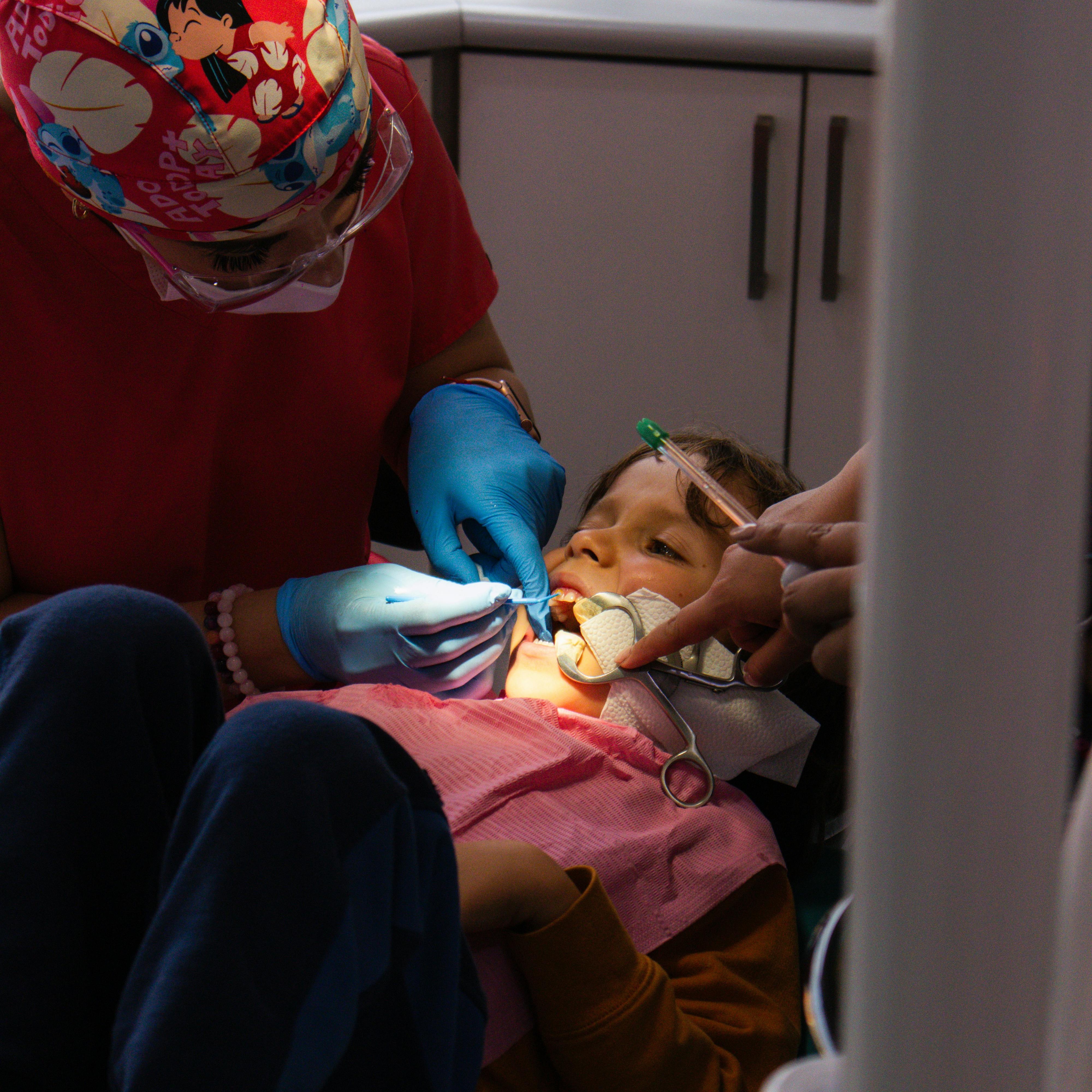 Teenager with braces smiling during a routine orthodontic visit