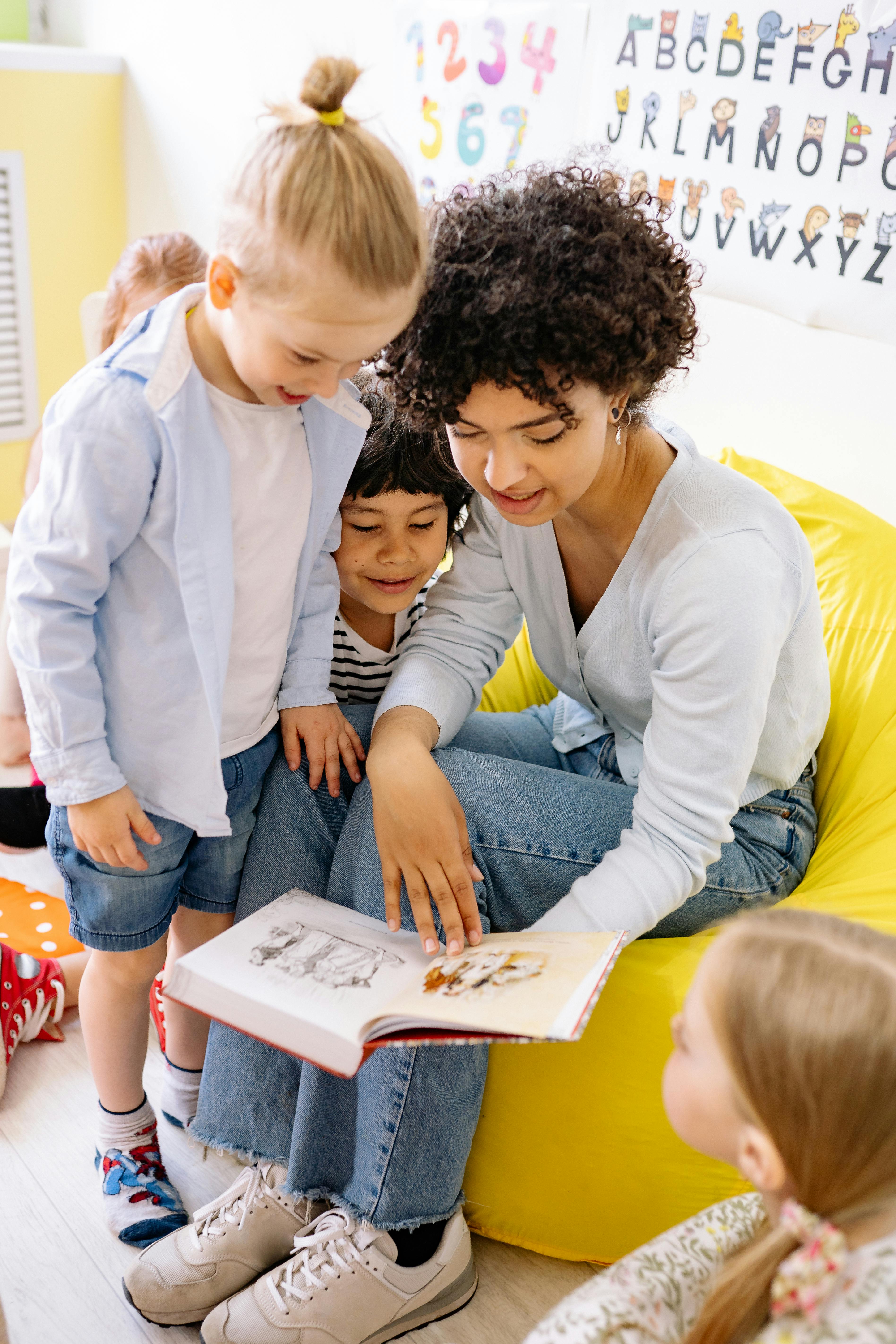 Teacher and children exploring a garden together