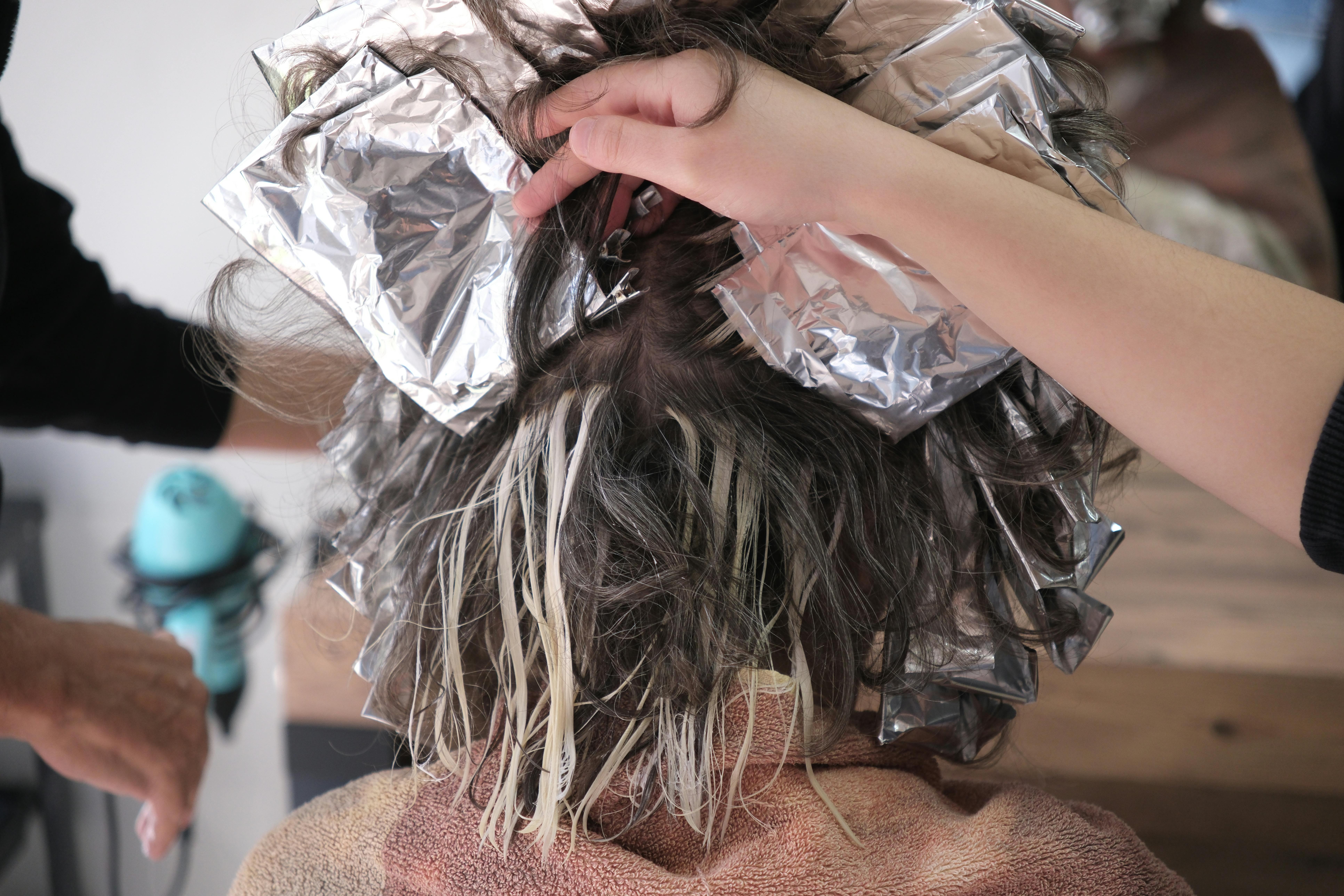 Stylist working on a client’s hair